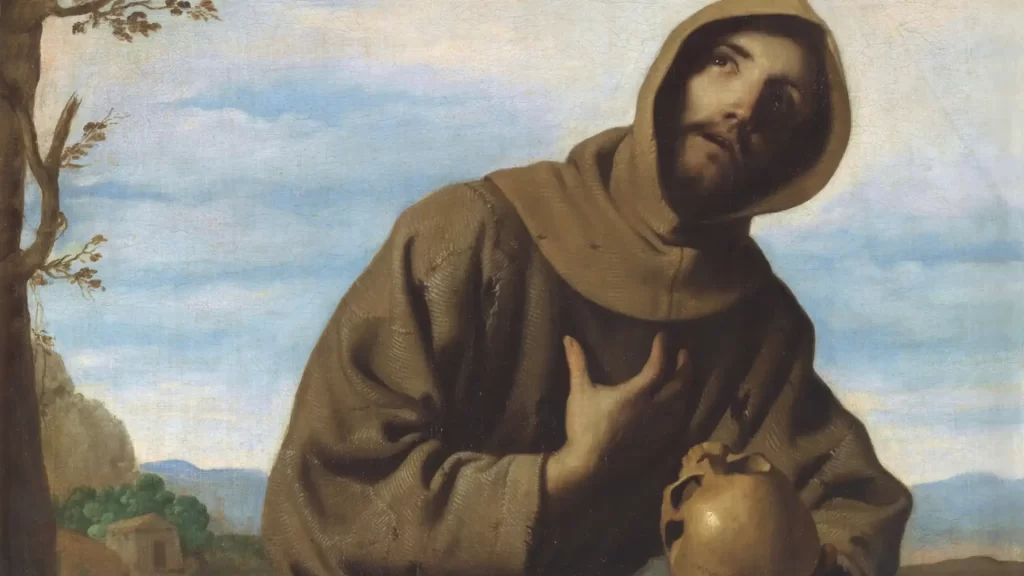 Pintura de San Francisco en oración con calavera en mano, obra de Zurbarán, símbolo de muerte al amor propio y contemplación espiritual.